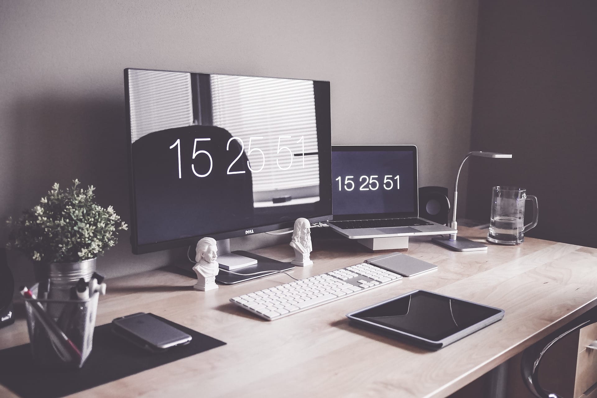 A desk with a computer and minimal decorations